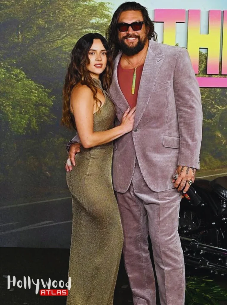 Adria Arjona stuns during Jason Momoa Date Night in a metallic cutout gown