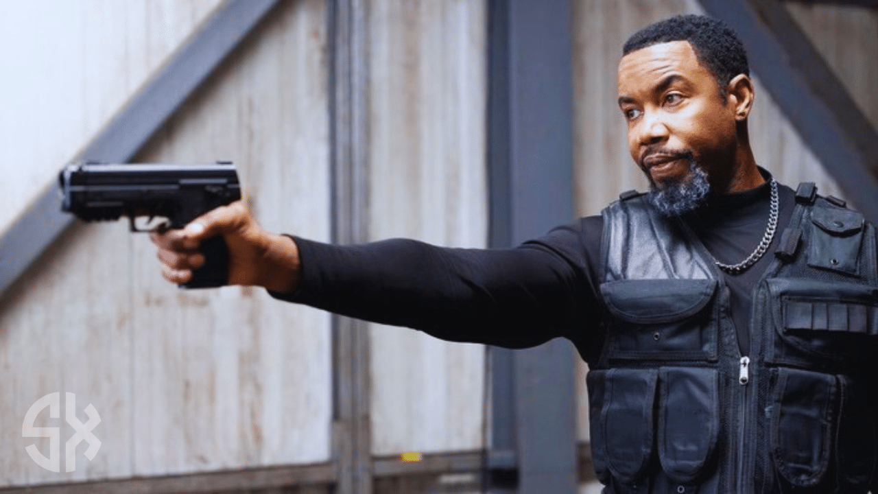 Michael Jai White as Jaxen delivering a powerful kick in Trouble Man 2025 action scene