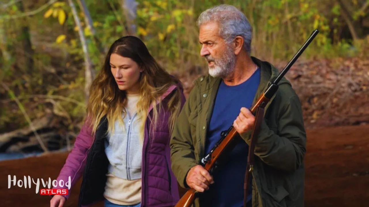 Mel Gibson in Hunting Season 2025 action thriller protecting a wounded woman in the woods